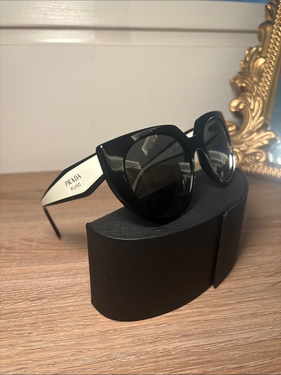 Prada Accessories - Prada Black Frame with White Arms Cat-Eye Sunglasses- With Case. AS IS